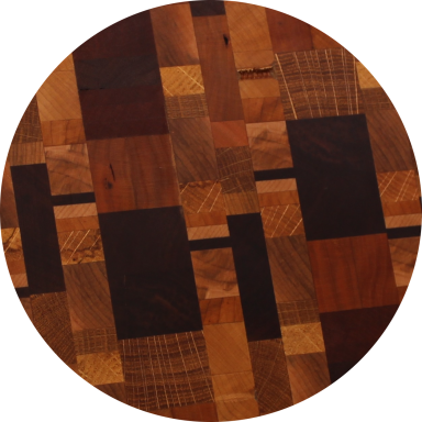 Mosaic with Maple, Cherry, Black Walnut, White Oak Close-up of mosaic design cutting board with many species of wood.